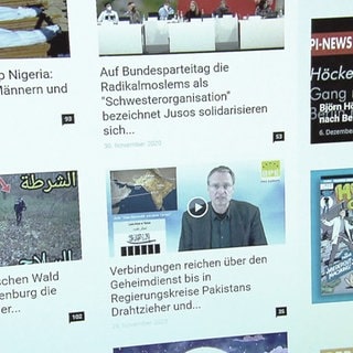 Bildschirm mit Nachrichten-Teasern - Fake News