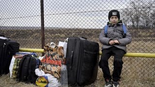 Ukrainian citizens arrive in Romania by crossing the Siret border after Russia's ongoing 